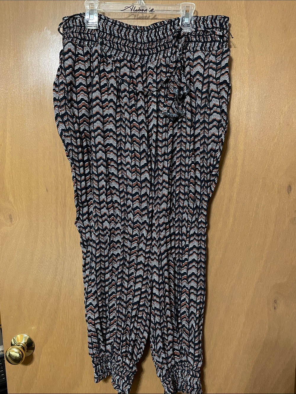 Anthropologie Black Jogger with Cream & Rust Wave Print